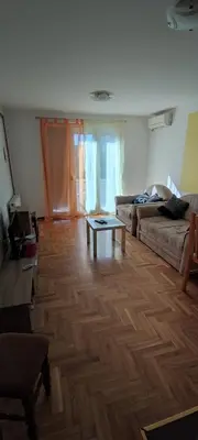 a living room with a couch and a coffee table at Apartmani Sovica in Vrnjačka Banja