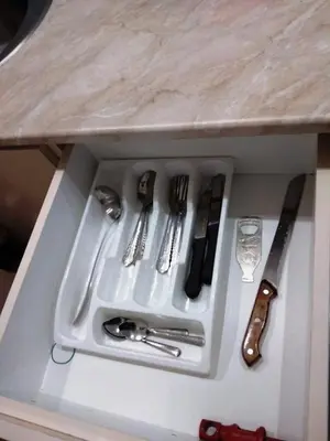 a white tray with utensils sitting on a table at Kopaonik,Sunčana dolina,Apart-Pavlovic in Kopaonik