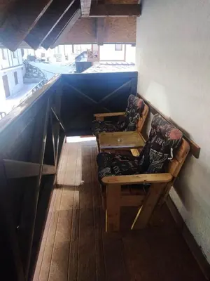 a room with two benches with pillows on them at Kopaonik,Sunčana dolina,Apart-Pavlovic in Kopaonik