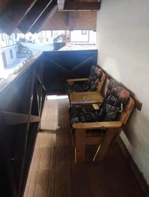 a room with a bench in a room with a window at Kopaonik,Sunčana dolina,Apart-Pavlovic in Kopaonik