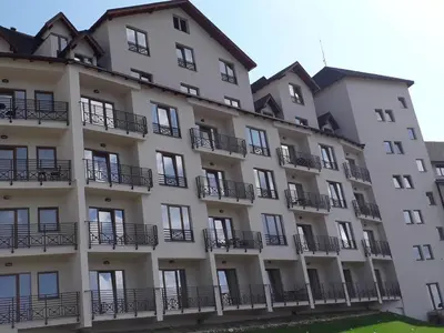 an apartment building with balconies on the side of it at Dream Milmari L12 Apartman in Kopaonik