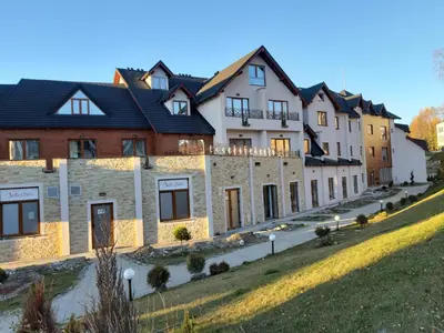 a row of houses on a hill at Dream Milmari L12 Apartman in Kopaonik