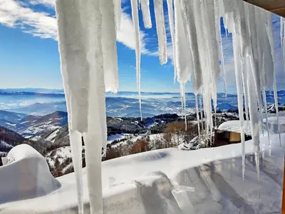 an image of icicles hanging from a window at Dream Milmari L12 Apartman in Kopaonik