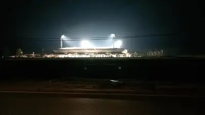 a lit up building at night with lights at APARTMAN “POD KRALJEVICOM” in Zaječar