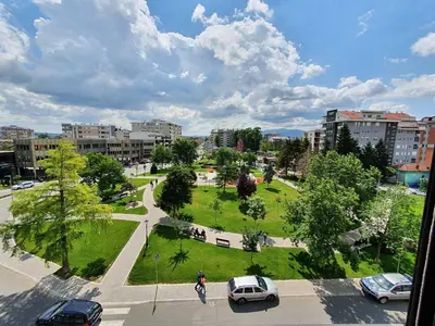 a view of a park with cars parked in a city at Alo Alo Apartman 6 in Kruševac
