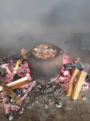a pot sitting on top of a fire at Idila in Kruševac