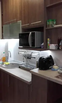 a kitchen with a sink and a microwave at Vila PAHULJA A6 in Kopaonik