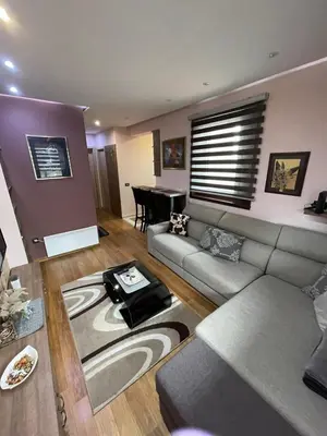 a living room with a couch and a table at Vila PAHULJA A6 in Kopaonik
