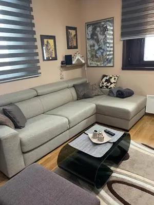 a living room with a couch and a coffee table at Vila PAHULJA A6 in Kopaonik