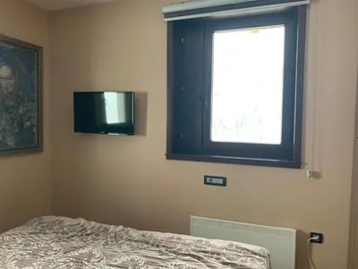 a bedroom with a window and a bed in it at Vila PAHULJA A6 in Kopaonik