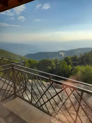 a view of the valley from the balcony of a house at Prezident Marta in Kopaonik