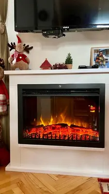 a fireplace with a fire in a living room at Vila Boris, Apartman Aleksej - Kopaonik in Kopaonik