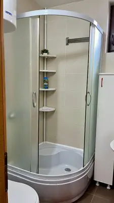 a shower with a glass door in a bathroom at Vila Boris, Apartman Aleksej - Kopaonik in Kopaonik