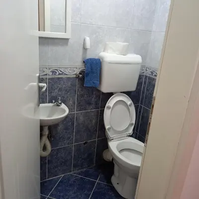 a bathroom with a toilet and a sink at Apartman Domina in Kruševac