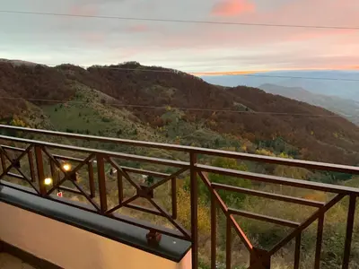 a balcony with a view of a mountain at Milmari Mountain view - I11 in Kopaonik