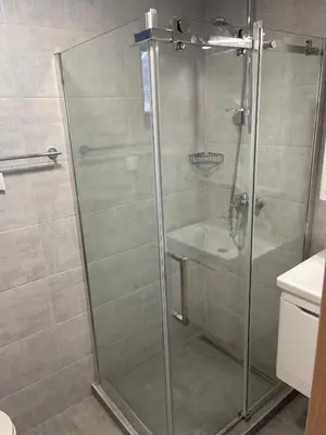 a shower with a glass door in a bathroom at Desetka Kopaonik in Kopaonik