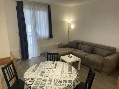 a living room with a couch and a table at Desetka Kopaonik in Kopaonik