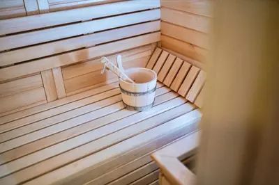a small tub in a sauna with a bucket at K2 Chalet in Kopaonik