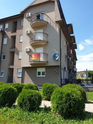 a building with balconies on the side of it at Lux Apartman Ristić 1 in Soko Banja