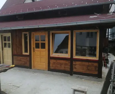 a house being constructed with wooden doors and windows at kuća za odmor marković in Kopaonik