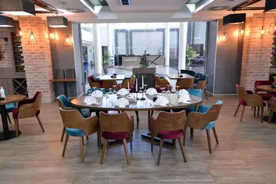 a dining room with a table and chairs at Spa Resort & Hotel Vrnjačke Terme in Vrnjačka Banja