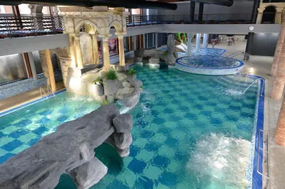 an indoor pool in a hotel with a water park at Spa Resort & Hotel Vrnjačke Terme in Vrnjačka Banja
