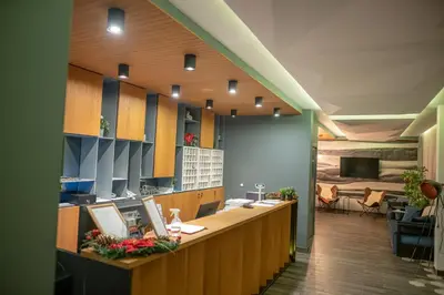 an office lobby with a reception desk and a room at FeelSTONE apartmani Brzeće in Brzeće