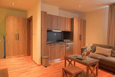 a living room with a couch and a table at FeelSTONE apartmani Brzeće in Brzeće