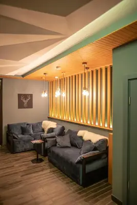 a living room with couches in a room with windows at FeelSTONE apartmani Brzeće in Brzeće