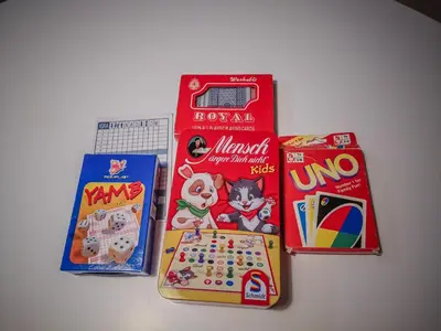 a group of games and other toys on a table at STAR apartman Brzece Kopaonik in Brzeće