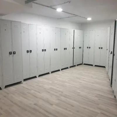 a large room with white lockers in a gym at Apartman Noalux Kopaonik in Kopaonik