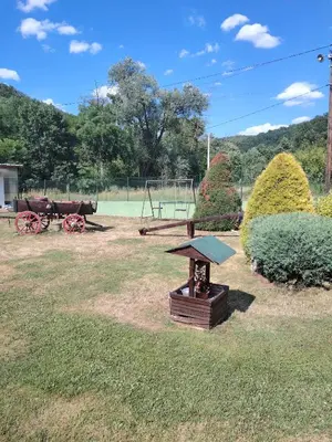 a park with a playground with a bench and a table at Apartmani Mihajlovic Sisevac in Sisevac