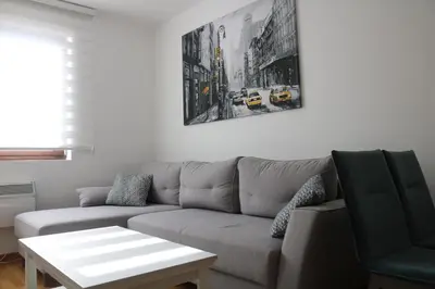 a living room with a couch and a table at Vila Irina Kopaonik in Kopaonik