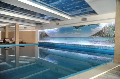 a swimming pool with a view of the ocean at Milmari Resort - Lux Apartment in Kopaonik