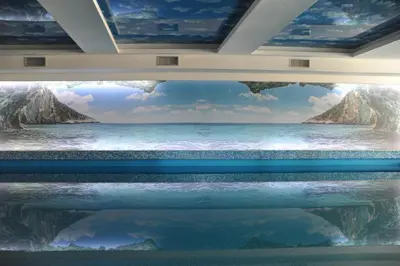 a room with a painting of the ocean at Milmari Resort - Lux Apartment in Kopaonik