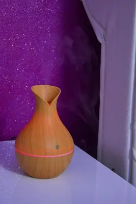 a wooden vase sitting on top of a table at Apartmani Tajna in Paraćin