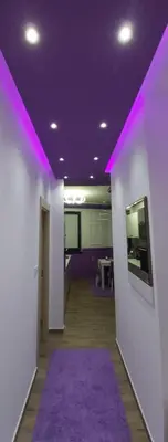 a hallway with a purple ceiling and a purple rug at VIOLET QUEEN in Kopaonik