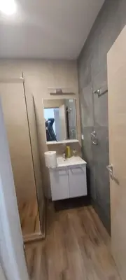 a bathroom with a sink and a mirror and a shower at VIOLET QUEEN in Kopaonik