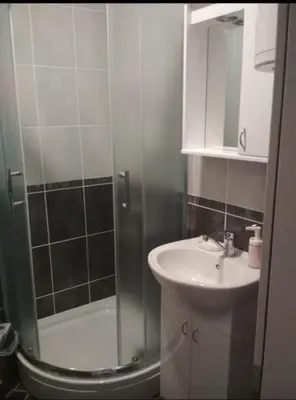 a bathroom with a shower and a sink at Talija Apartman in Vrnjačka Banja