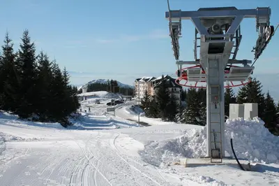a ski lift on top of a snow covered slope at Sunčani Breg-Sunčana KOP studio in Kopaonik