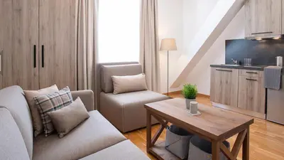 a living room with a couch and a table at Apartman Davidović in Brzeće