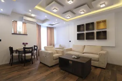 a living room with a couch and a table at Bella apartments in Kruševac