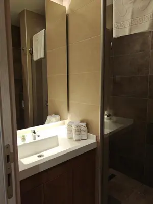 a bathroom with a sink and a shower at Star Hill - Koznik Konaci in Kopaonik