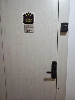 a wooden door with a sign on it at Star Hill - Koznik Konaci in Kopaonik