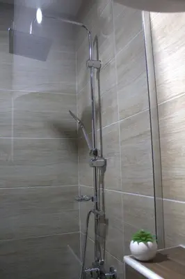 a shower with a glass door in a bathroom at Kraljev Konak in Kopaonik