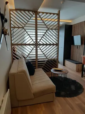 a living room with a couch and a table at PRESIDENT KOP A-1 in Kopaonik