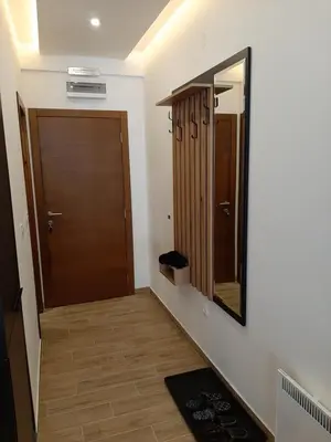 a hallway with a door and a mirror at PRESIDENT KOP A-1 in Kopaonik