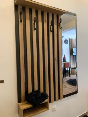a mirror on a wall with a shelf and a mirror at PRESIDENT KOP A-1 in Kopaonik
