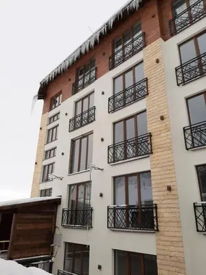 a building with balconies on the side of it at PRESIDENT KOP A-1 in Kopaonik