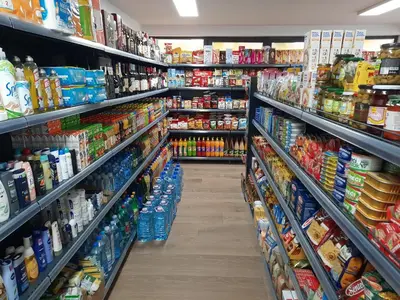 a aisle in a grocery store filled with lots of food at Apartman Kalina Suncani Breg in Kopaonik